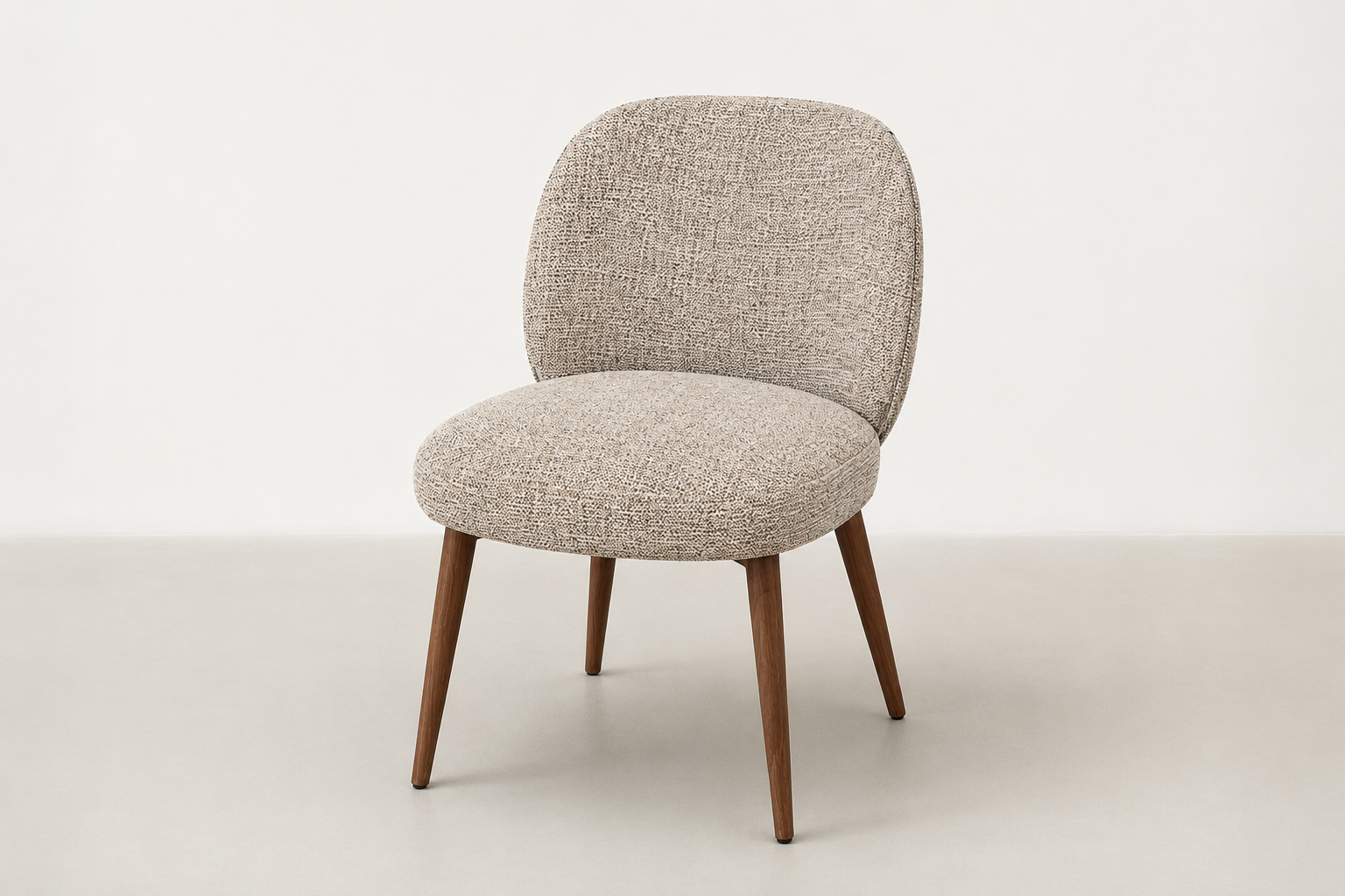 Apua dining chair with textured polyester upholstery, scoop-back design, and walnut-finish steel legs
