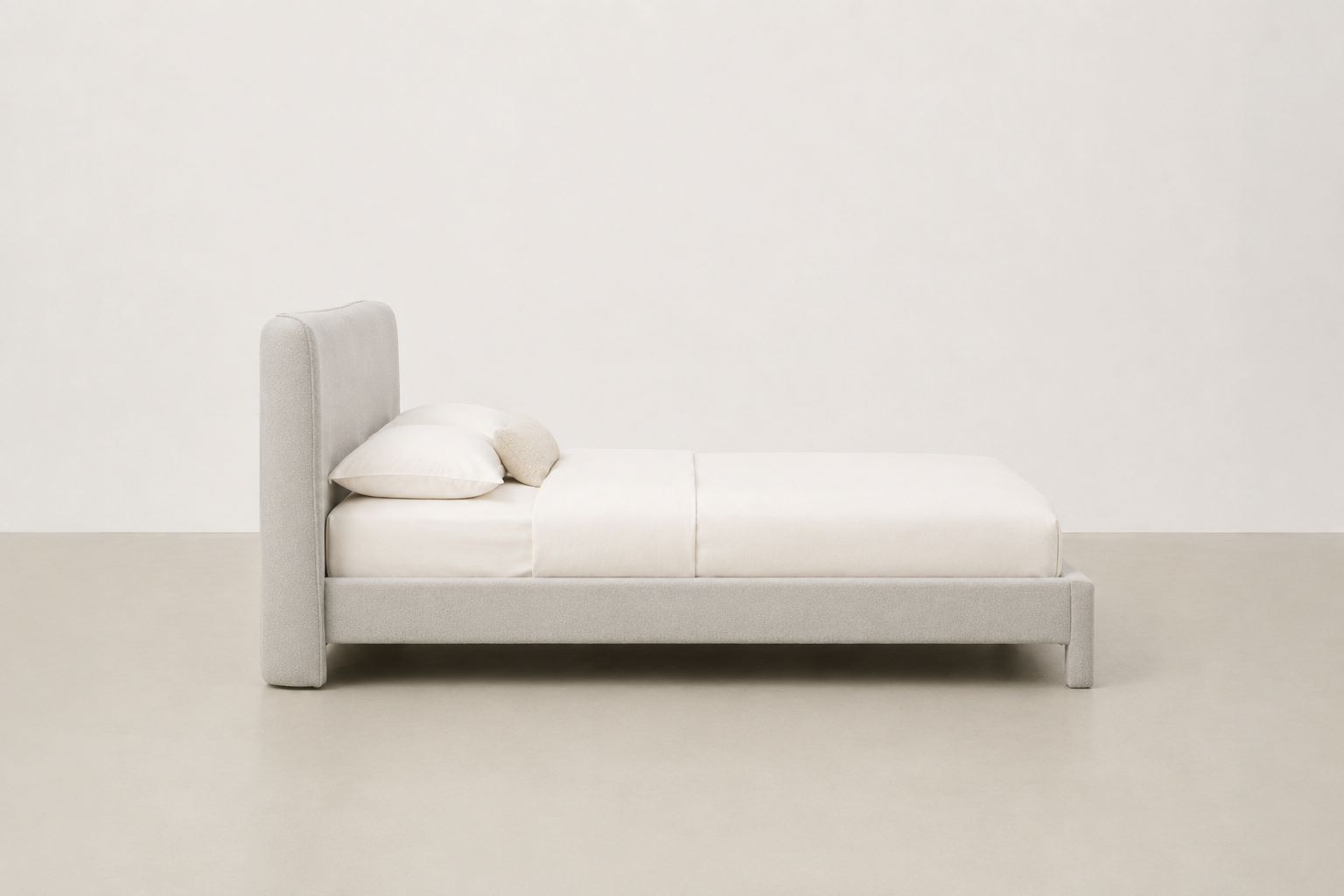 Bouclé platform bed with curved headboard and wide base – Aurora bed frame for Japandi Canadian bedrooms