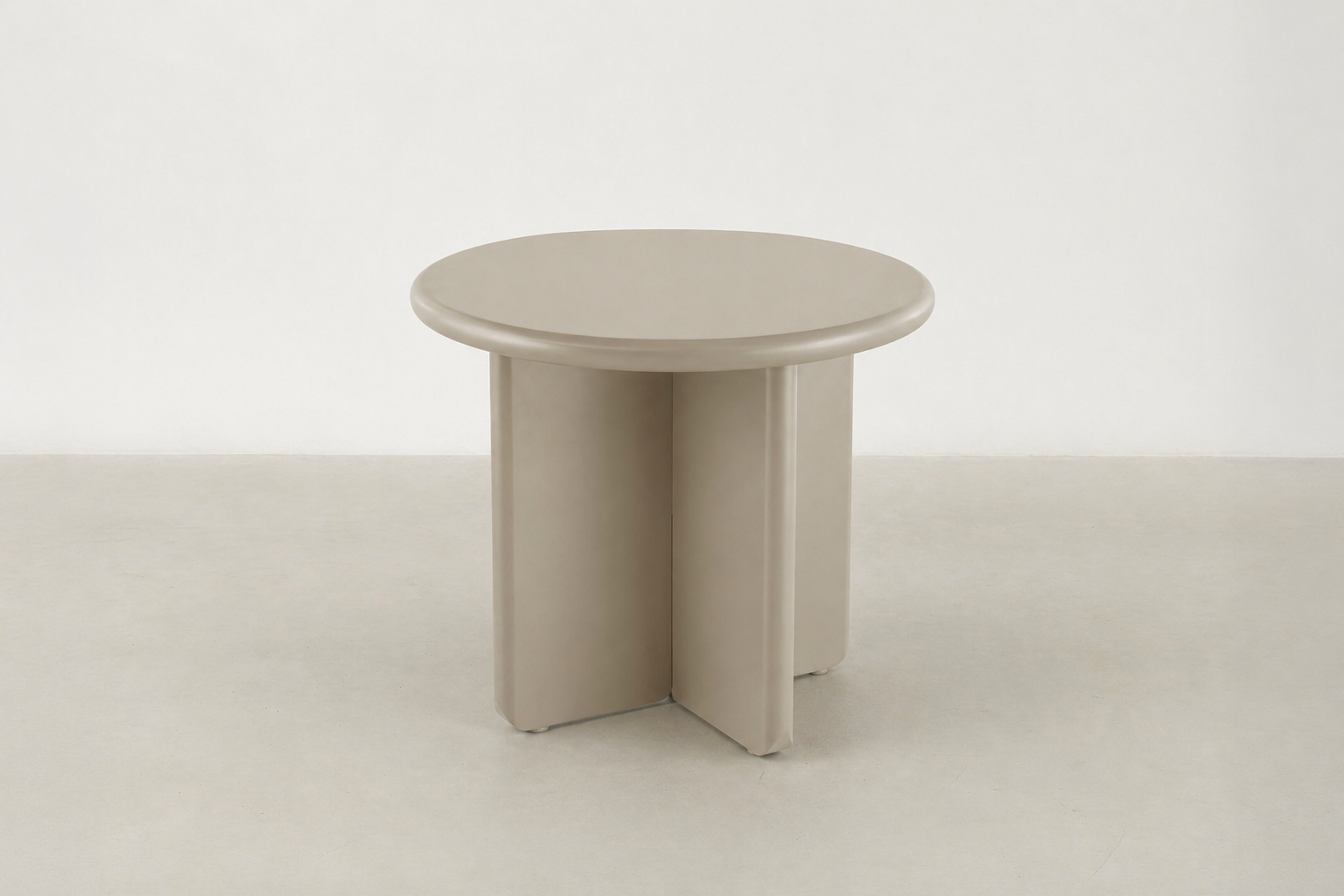 Arbor sculptural end table in matte beige with rounded pebble shape