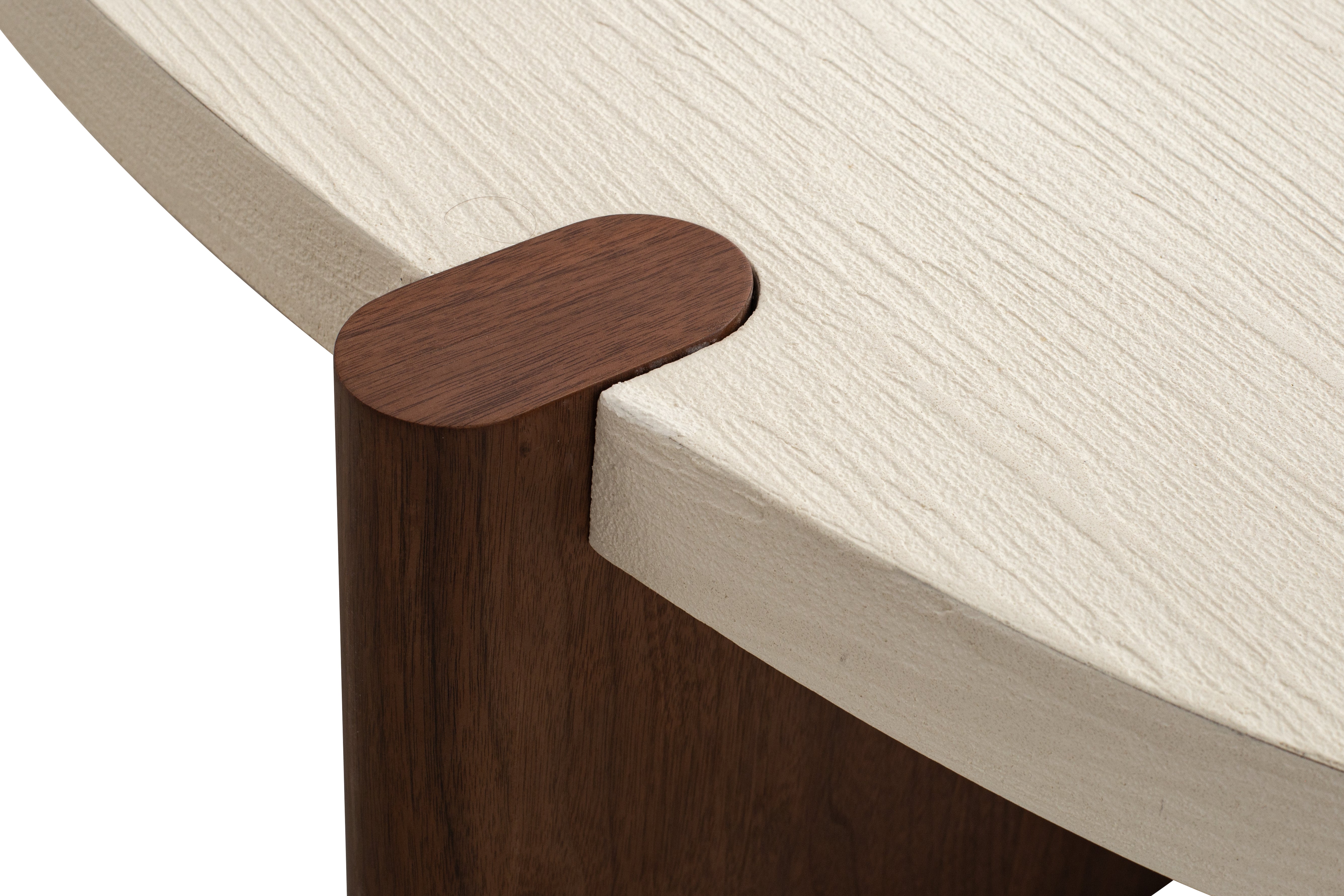 Nordli sculptural coffee table with walnut base and asymmetrical concrete-style top.