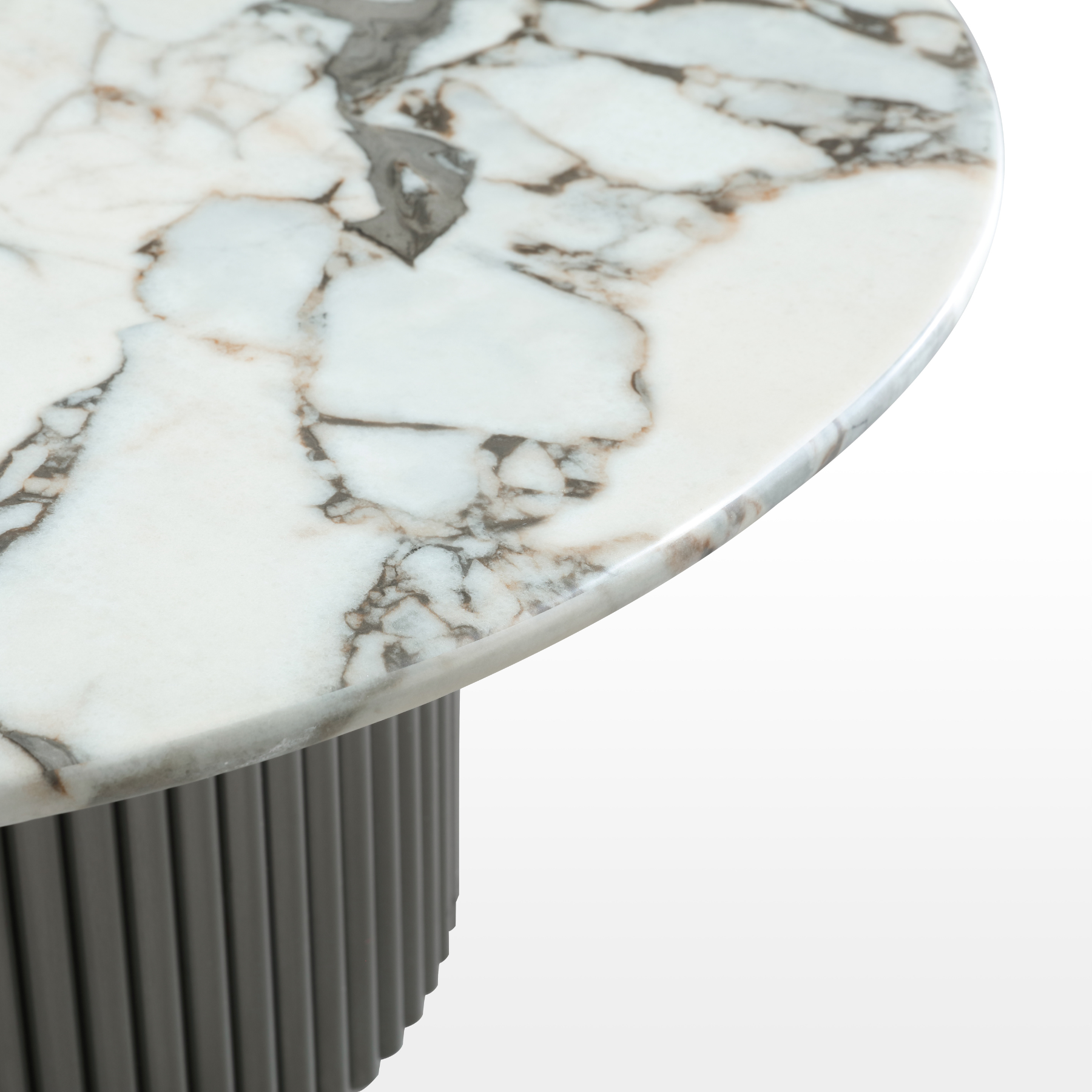 White round marble coffee table with veining and fluted black metal base – modern Canadian living room.