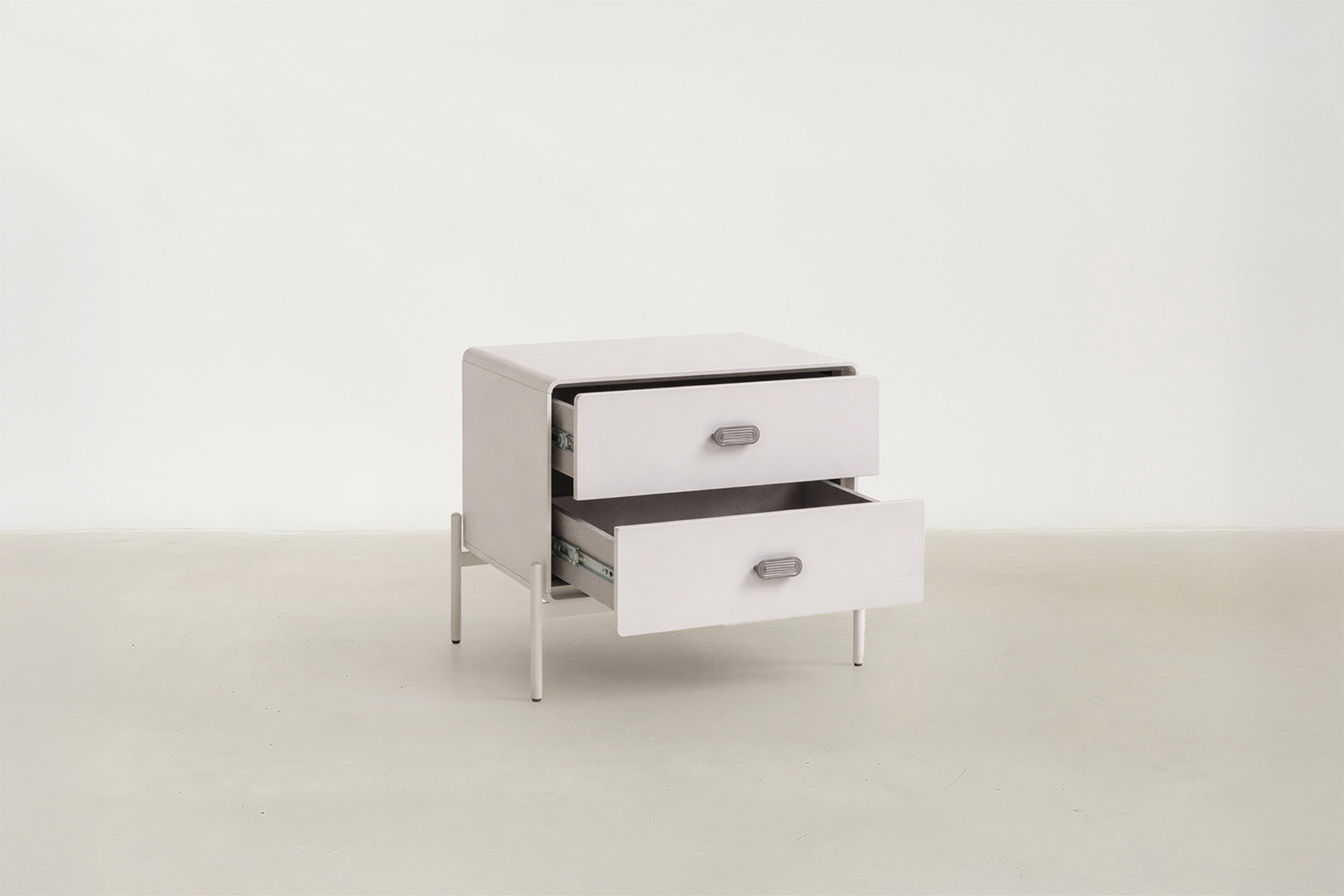 Lilane Luxe nightstand in matte beige with wave handle design and metal legs