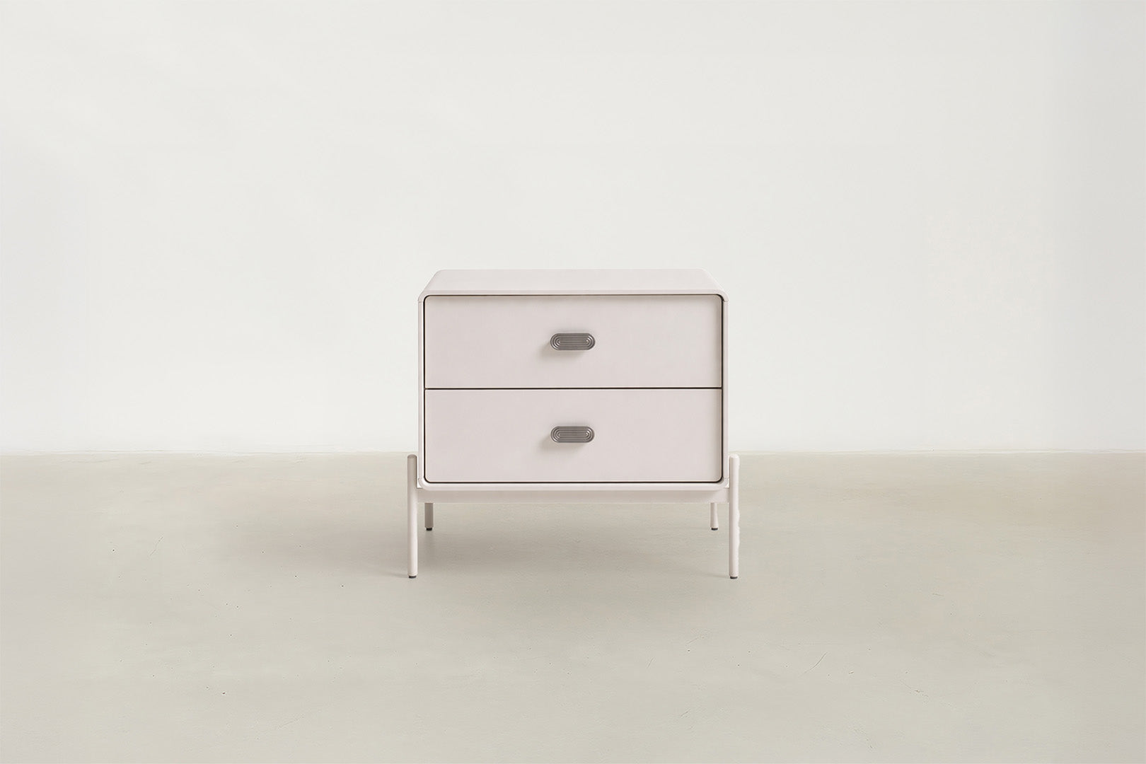 Lilane Luxe nightstand in matte beige with wave handle design and metal legs