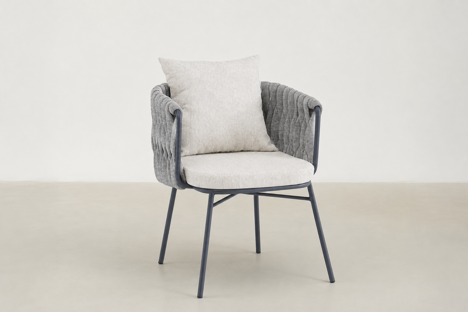 Sandbrekka Luxe outdoor dining chair with sintered stone table and all-weather rope chairs