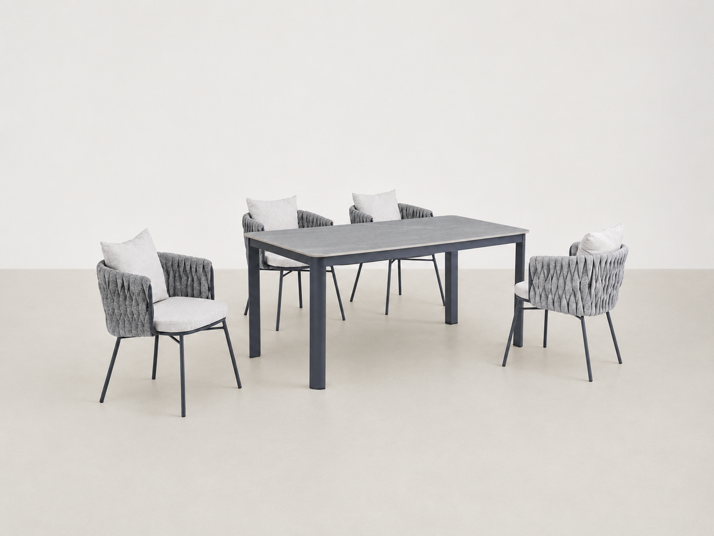Sandbrekka Luxe outdoor dining set with sintered stone table and all-weather rope chairs