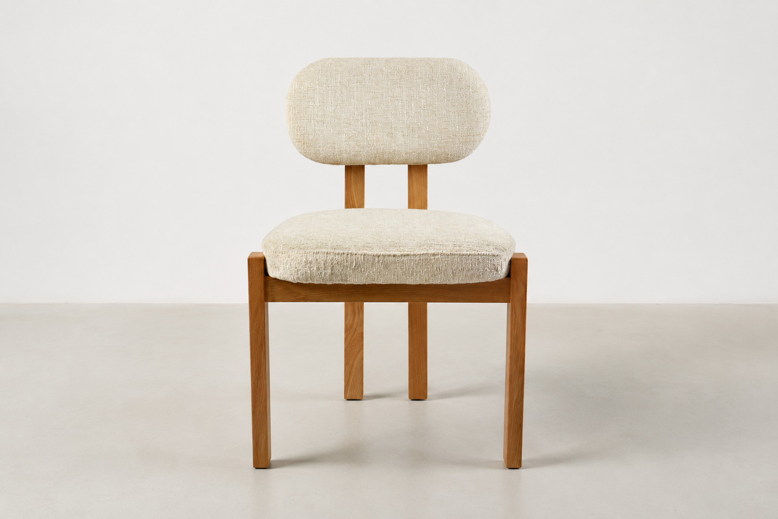 Sora Japandi dining chair with textured cream fabric and solid oak wood frame in natural stain