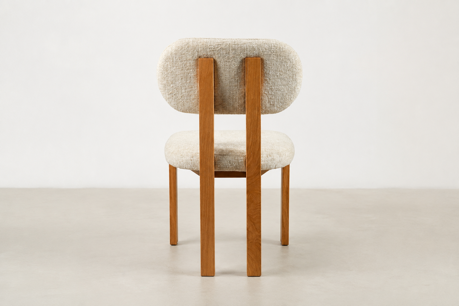 Sora Japandi dining chair with textured cream fabric and solid oak wood frame in natural stain