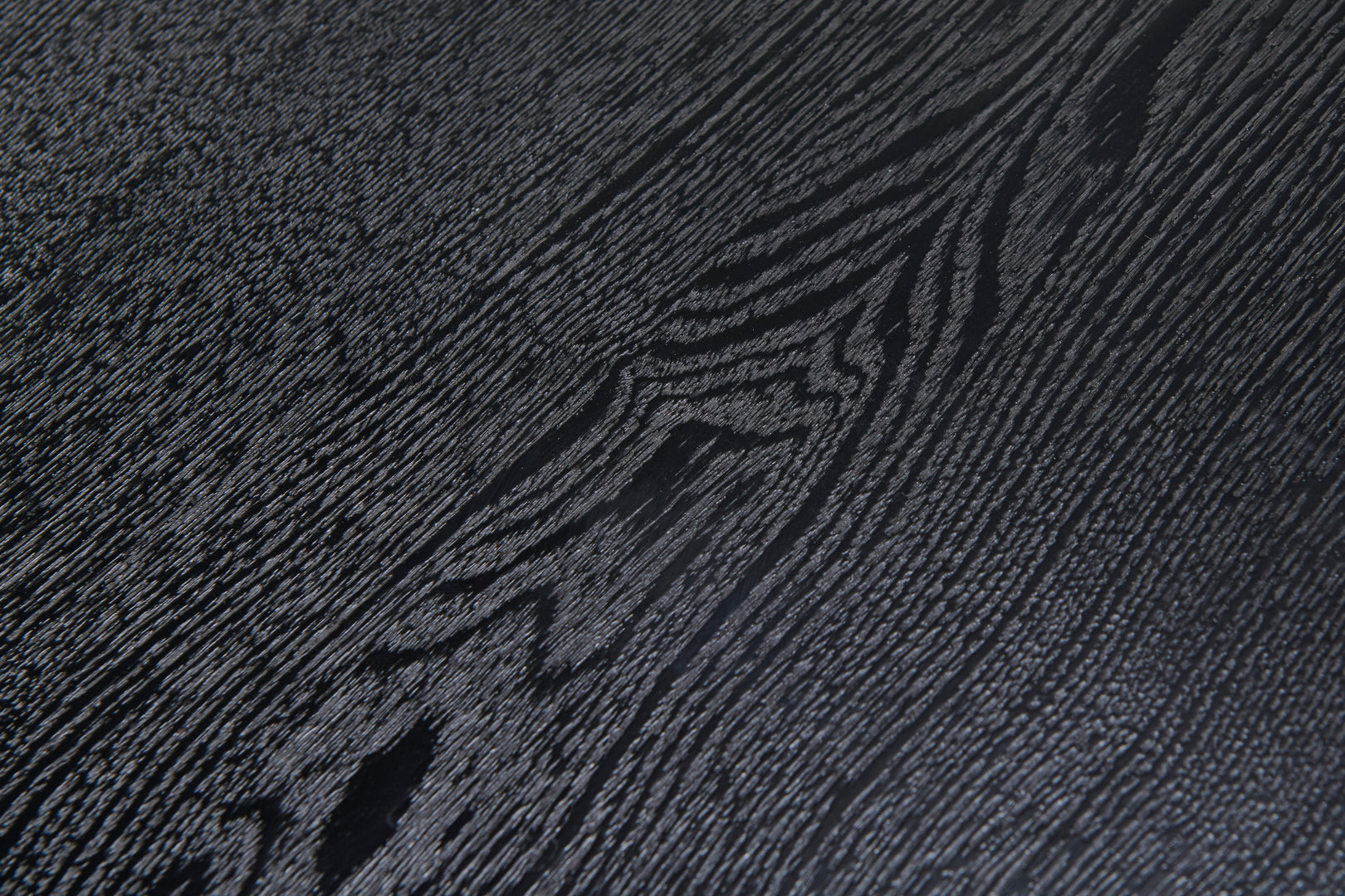 Narta Japandi round coffee table with deep black oak finish
