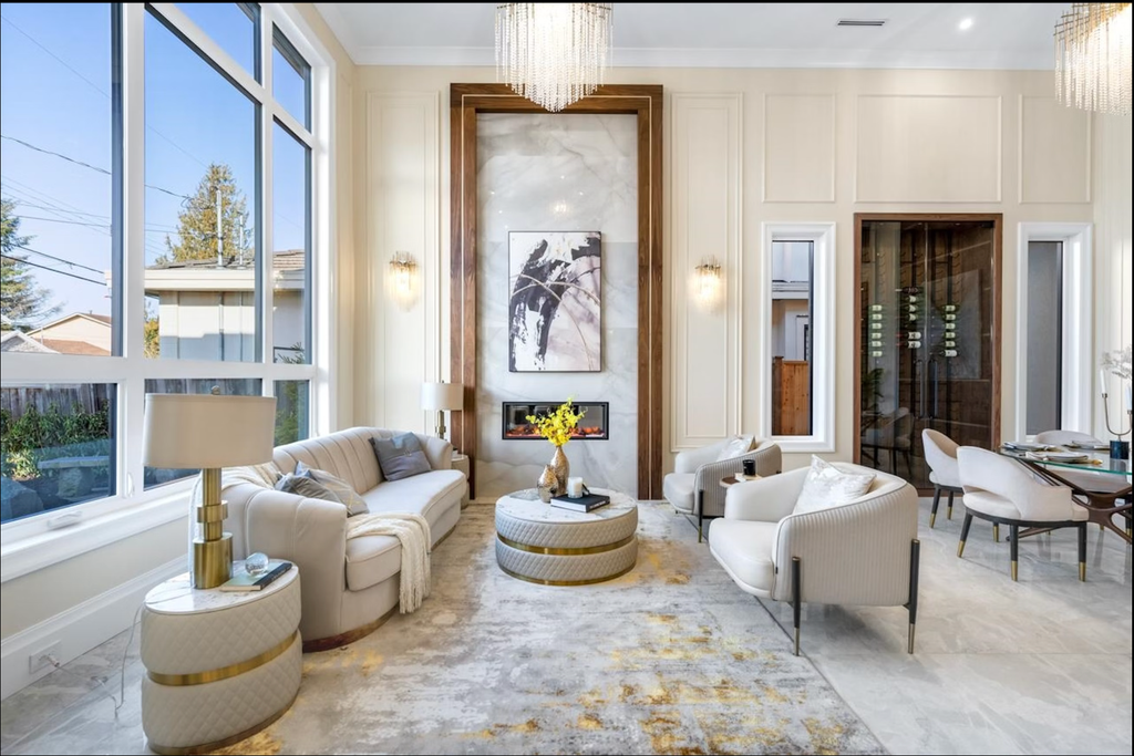 Sassaste luxury round coffee table with faux-marble top, quilted PU leather base, and gold accent banding.