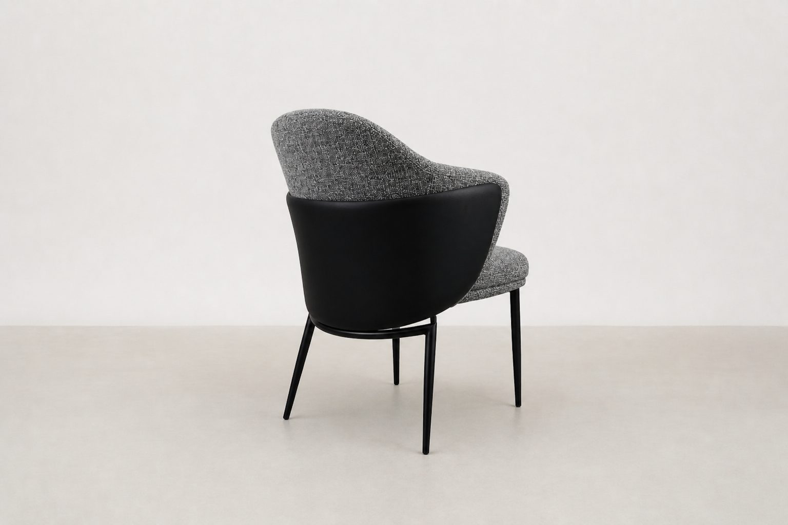"Sitifis modern curved back dining chair in grey fabric with taupe faux leather back and black steel legs.
"