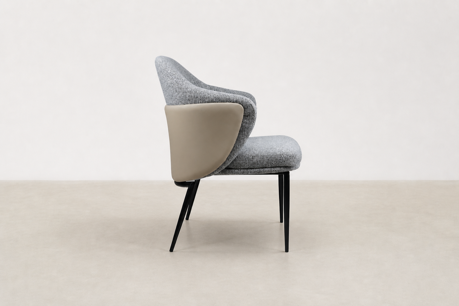 "Sitifis modern curved back dining chair in grey fabric with taupe faux leather back and black steel legs.
"