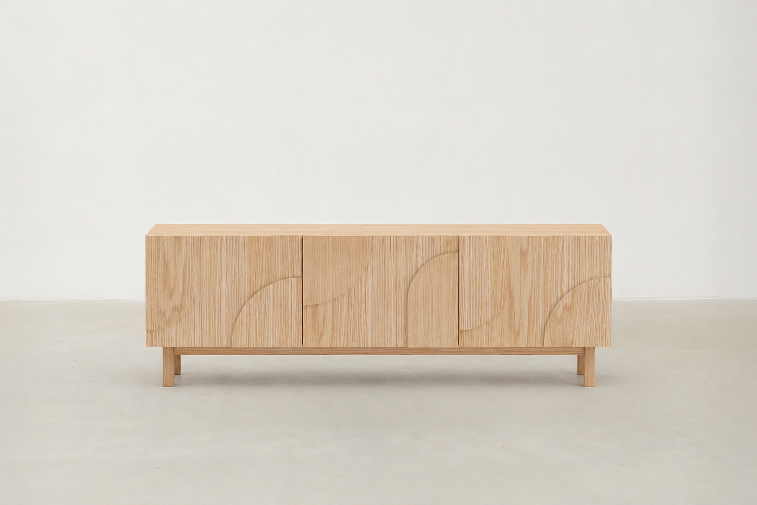 Troivat oak TV stand with circular laser-cut doors and tapered legs.