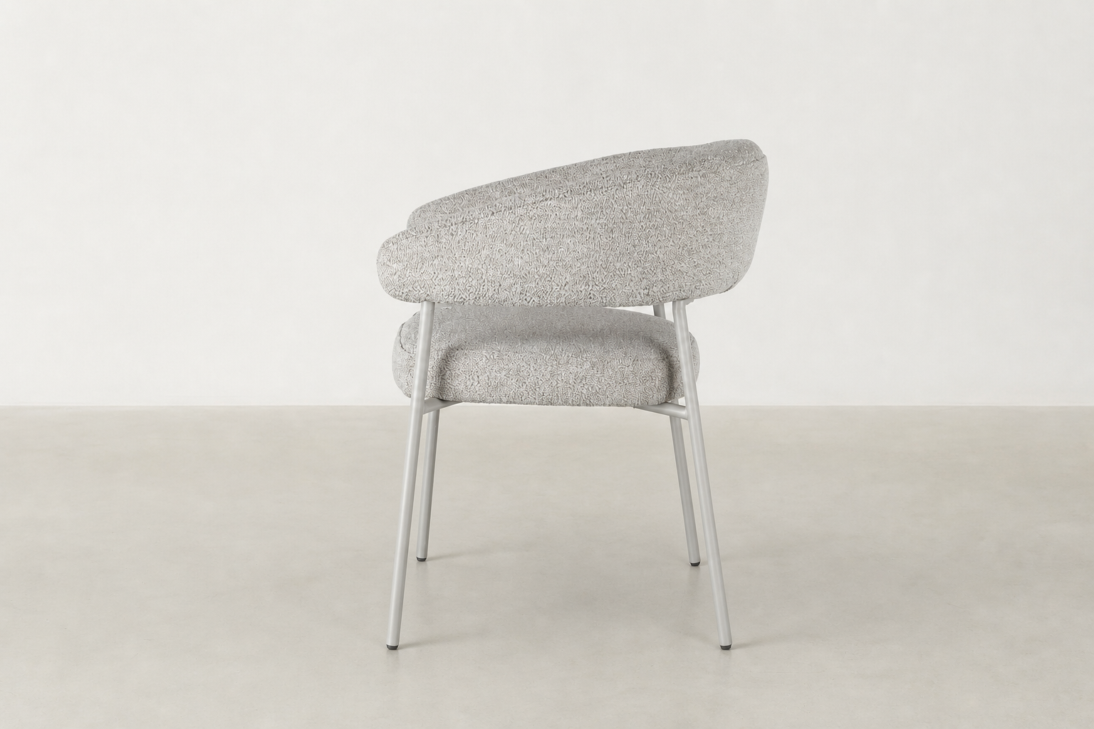Front view of Vista dining chair in beige textured fabric with curved backrest