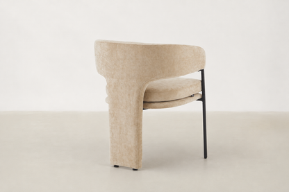 Aballo modern dining chair with upholstered rear leg detail and powder-coated steel frame