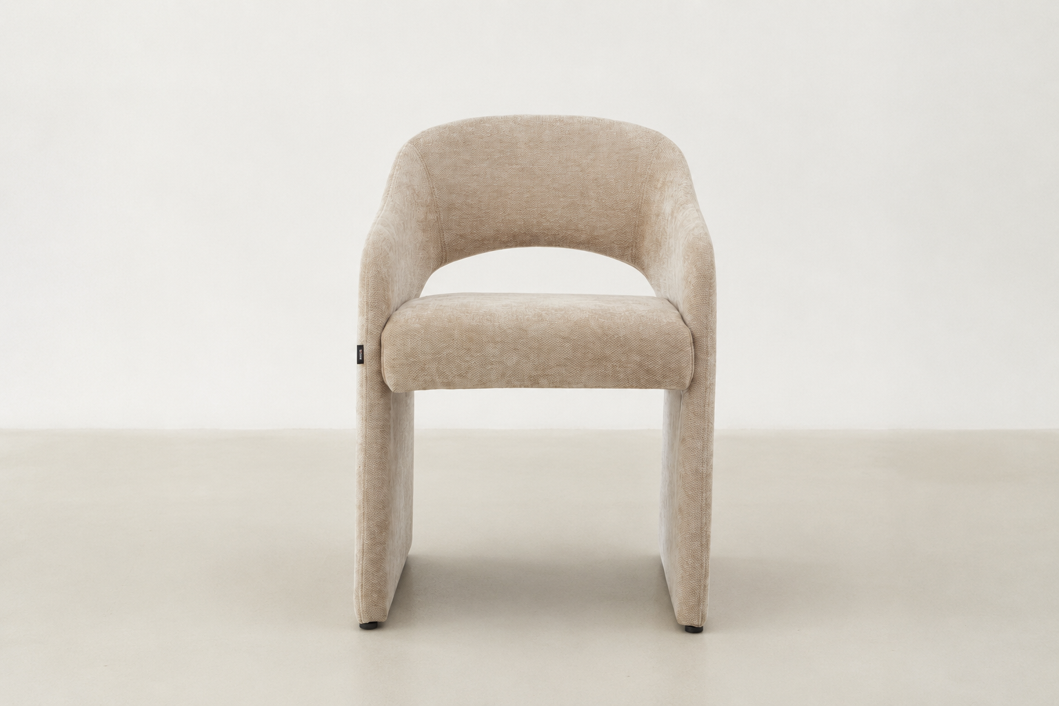 Curved upholstered dining chair with chenille fabric and handle detail – Arabona chair for Canadian dining rooms