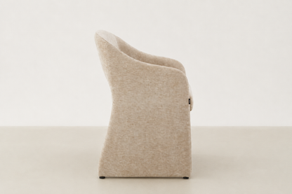 Curved upholstered dining chair with chenille fabric and handle detail – Arabona chair for Canadian dining rooms