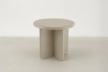 Arbor sculptural end table in matte beige with rounded pebble shape
