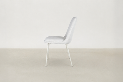 Bouclé dining chair with curved backrest and white metal legs – Aura chair for Canadian interiors