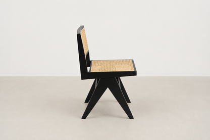 Baeloe Japandi dining chair with black wood frame and natural cane backrest