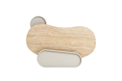 Kouri desk detail showing travertine-look glass surface and curved ivory legs