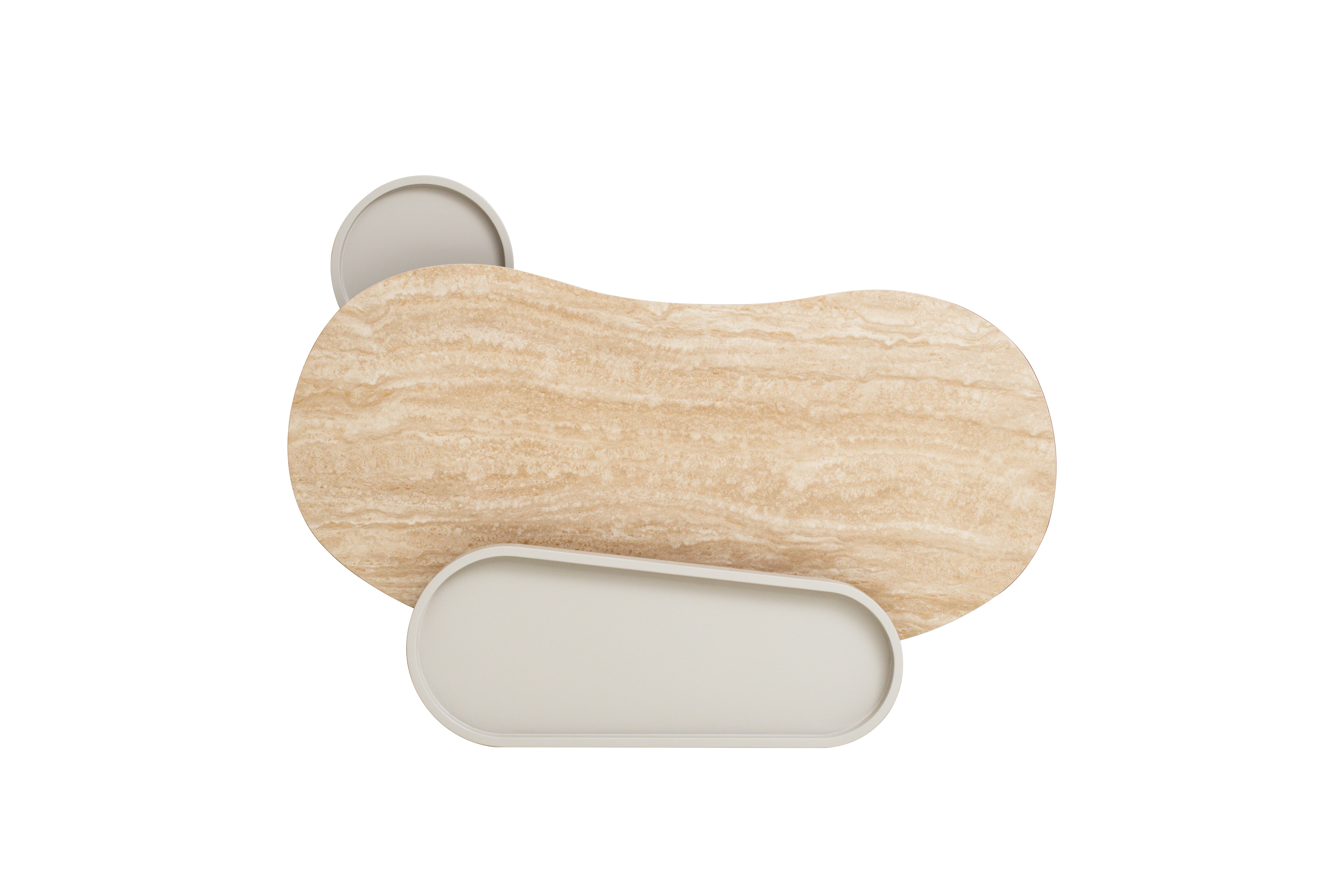 Kouri desk detail showing travertine-look glass surface and curved ivory legs