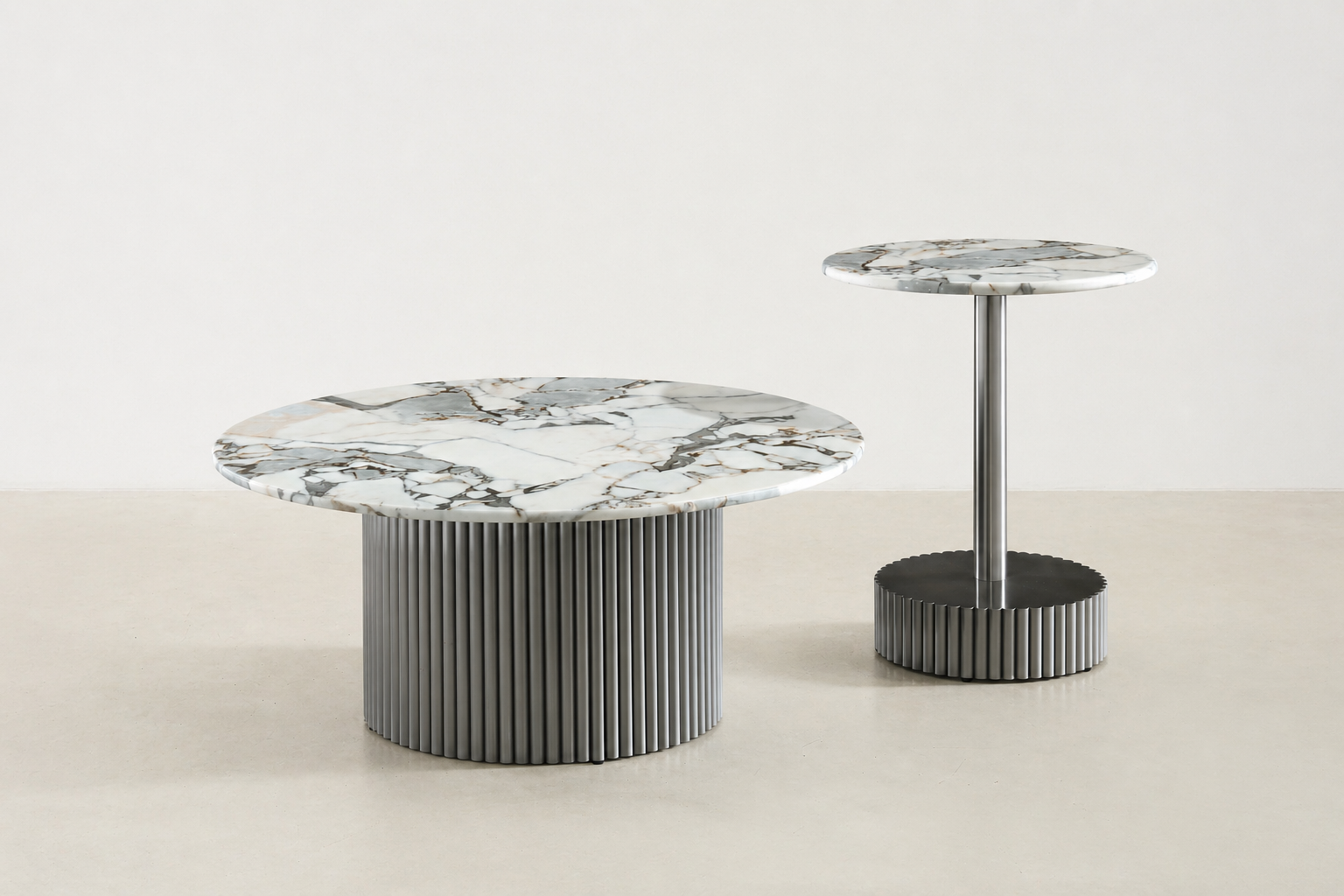 White round marble coffee table with veining and fluted black metal base – modern Canadian living room.