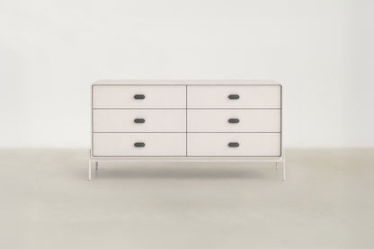Lilane Luxe dresser in matte beige with wave handle design and metal legs