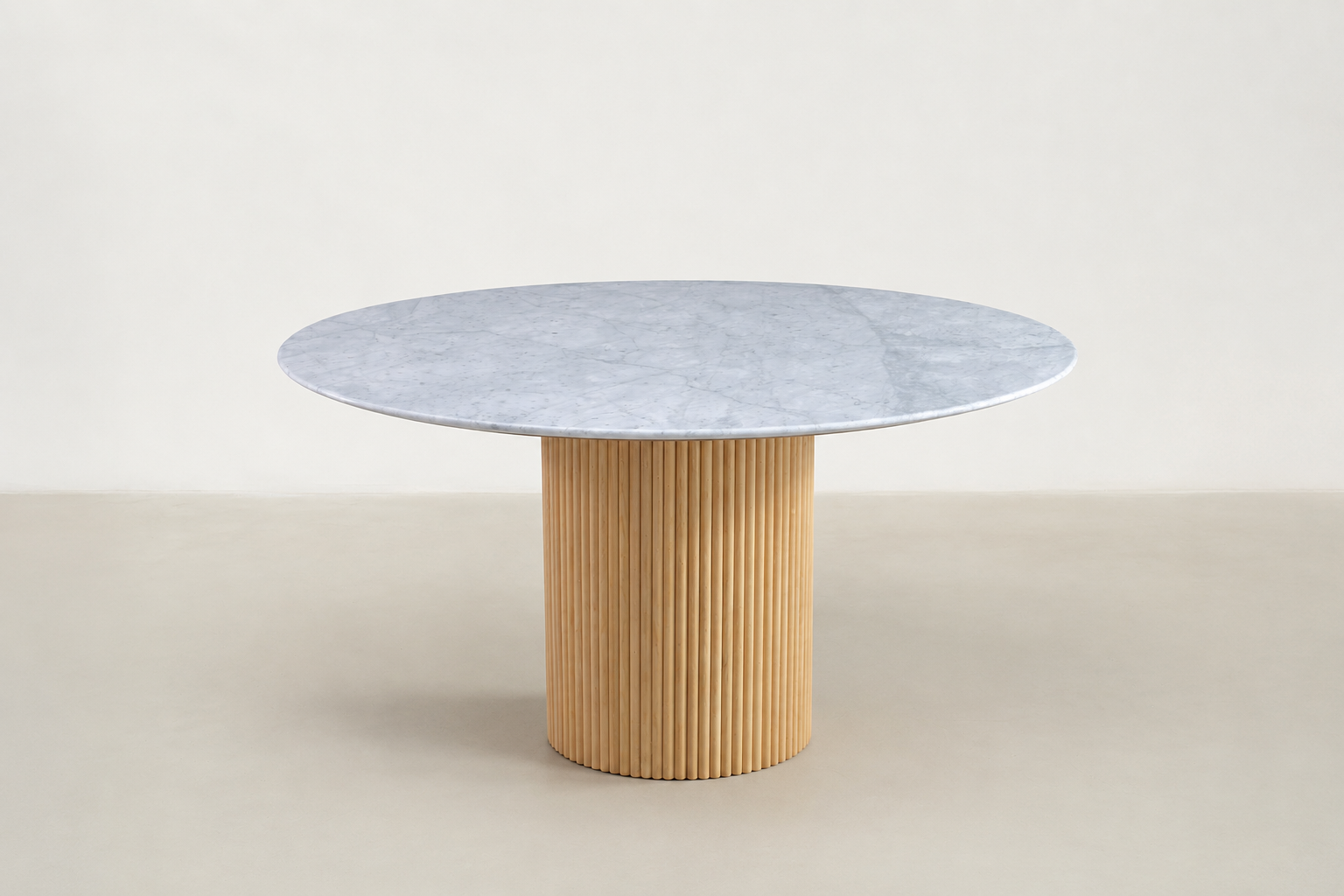 "Milo round marble dining table with fluted walnut base and Japandi-inspired design.
"