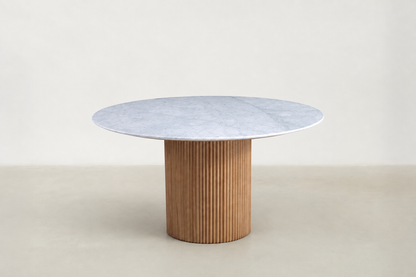 "Milo round marble dining table with fluted walnut base and Japandi-inspired design.
"