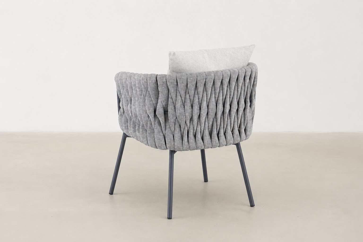 Sandbrekka Luxe outdoor dining chair with sintered stone table and all-weather rope chairs
