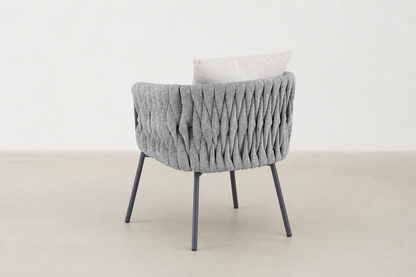 Sandbrekka Luxe outdoor dining chair with sintered stone table and all-weather rope chairs