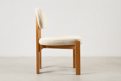 Sora Japandi dining chair with textured cream fabric and solid oak wood frame in natural stain