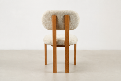 Sora Japandi dining chair with textured cream fabric and solid oak wood frame in natural stain