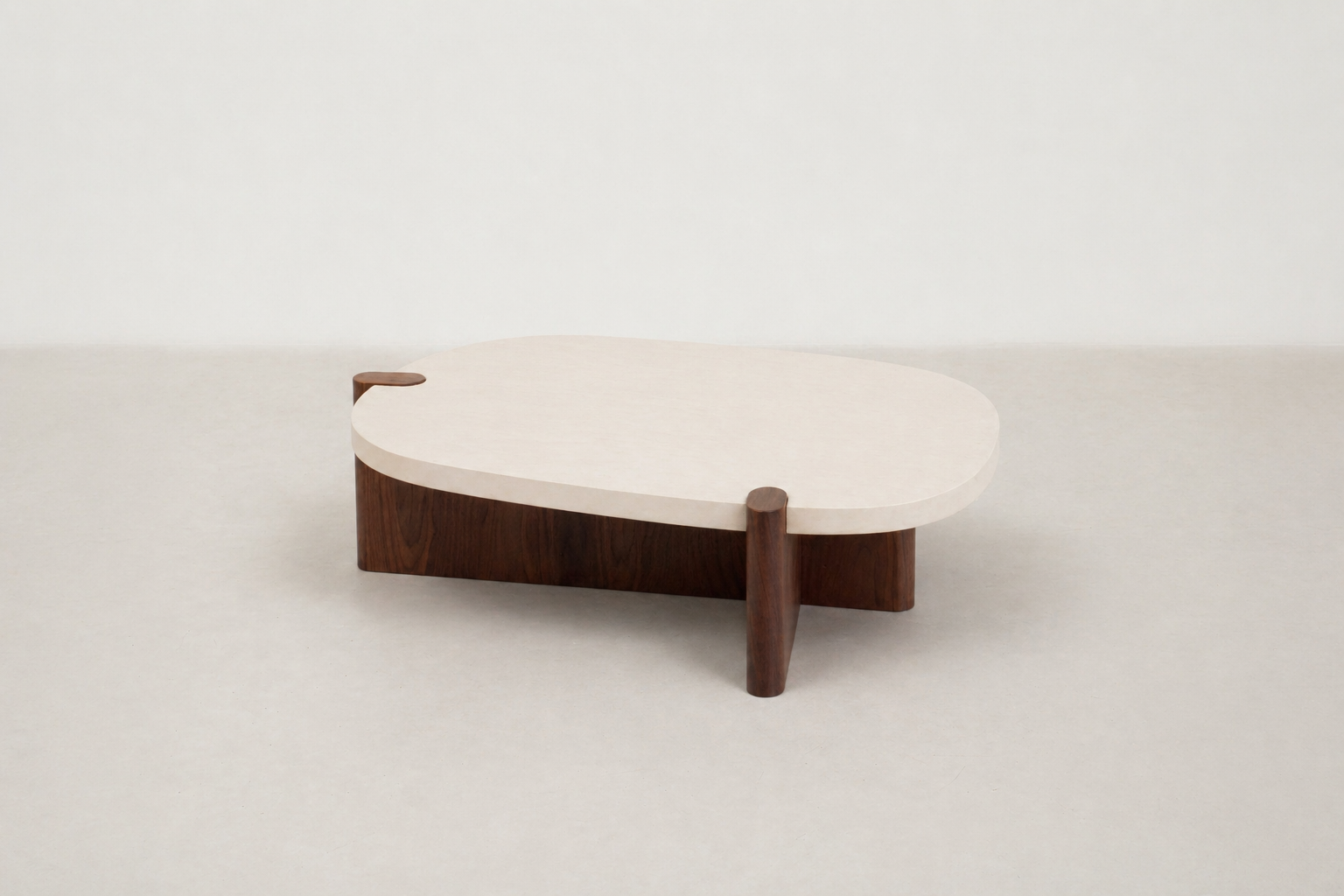 Nordli sculptural coffee table with walnut base and asymmetrical concrete-style top.