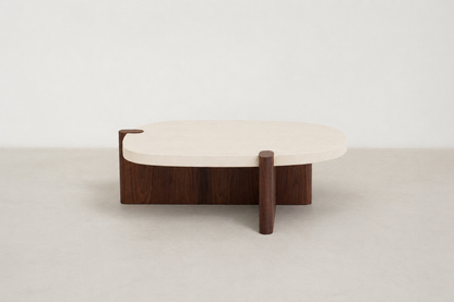 Nordli sculptural coffee table with walnut base and asymmetrical concrete-style top.