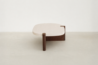 Nordli sculptural coffee table with walnut base and asymmetrical concrete-style top.