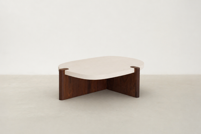Nordli sculptural coffee table with walnut base and asymmetrical concrete-style top.
