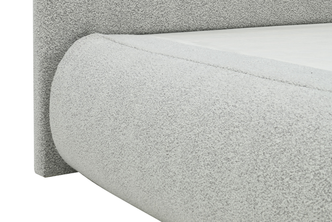 Sable light grey upholstered bed with rounded corners and low-profile design.