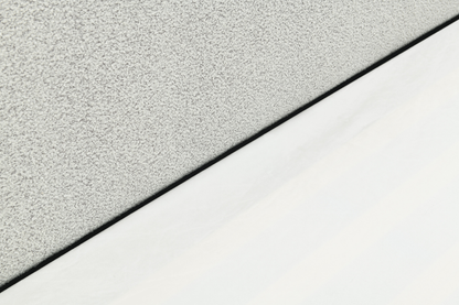 Sable light grey upholstered bed with rounded corners and low-profile design.