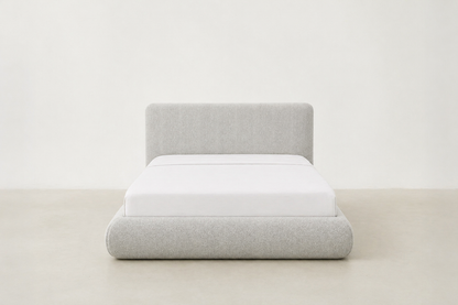 Sable light grey upholstered bed with rounded corners and low-profile design.