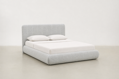 Sable light grey upholstered bed with rounded corners and low-profile design.