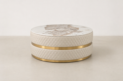 Sassaste luxury round coffee table with faux-marble top, quilted PU leather base, and gold accent banding.