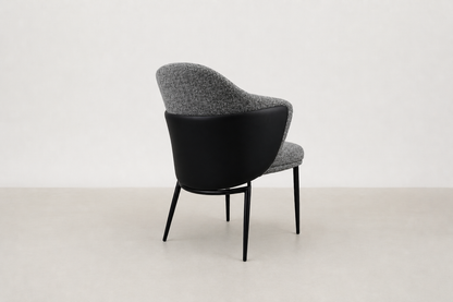 "Sitifis modern curved back dining chair in grey fabric with taupe faux leather back and black steel legs.
"