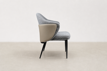 "Sitifis modern curved back dining chair in grey fabric with taupe faux leather back and black steel legs.
"