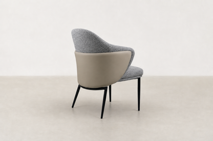 "Sitifis modern curved back dining chair in grey fabric with taupe faux leather back and black steel legs.
"