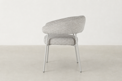 Front view of Vista dining chair in beige textured fabric with curved backrest